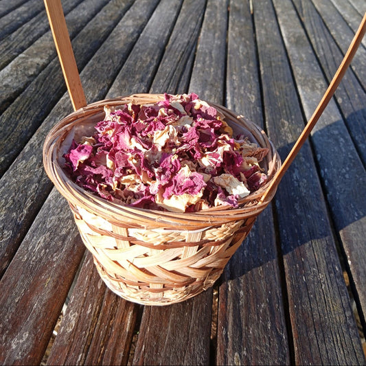 Basket of dried flowers on a wooden deck
